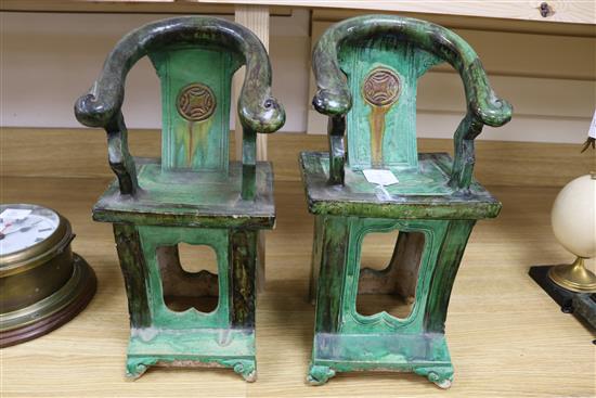 A near pair of Chinese sancai pottery models of horseshoe backed chairs, Ming dynasty, 41cm and 42cm